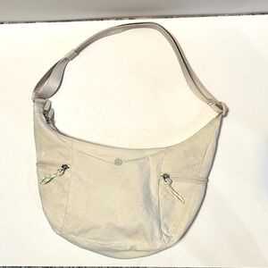 lululemon athletica Ivory Crescent Shoulder Hobo Sling Bag